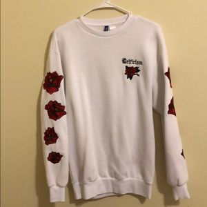 Criticism long sleeved sweatshirt with roses.